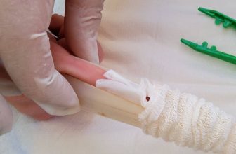 Push tubular gauze over applicator